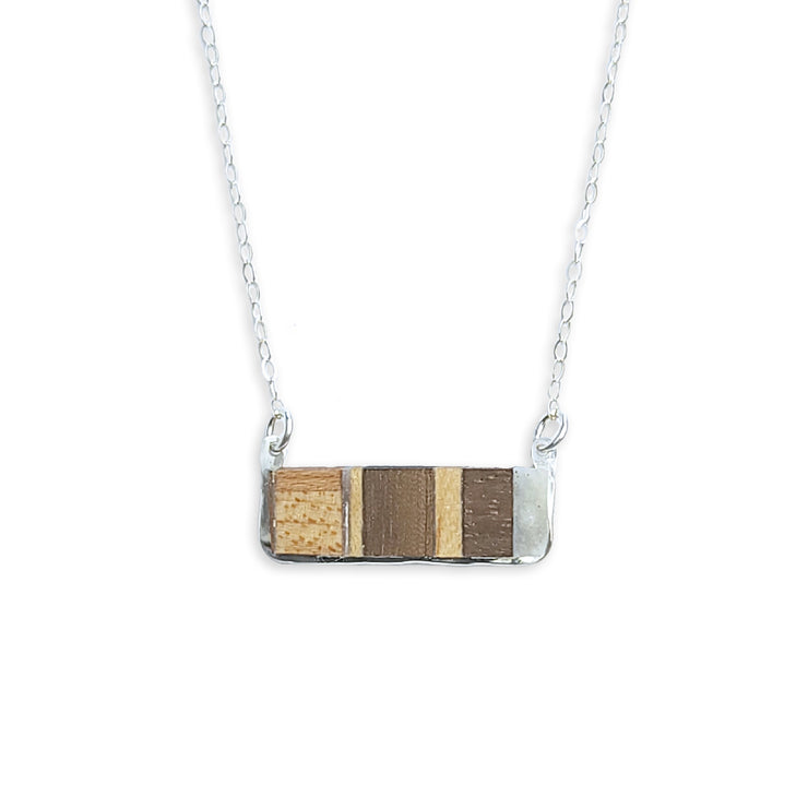 This piece is inspired and sourced from the scraps of local woodworkers. Each necklace will have a slightly different wood pattern and type. Framed in your choice of sterling silver or 14k gold-fill.  Buy One Plant One - One tree planted for every Branch+Barrel piece sold!