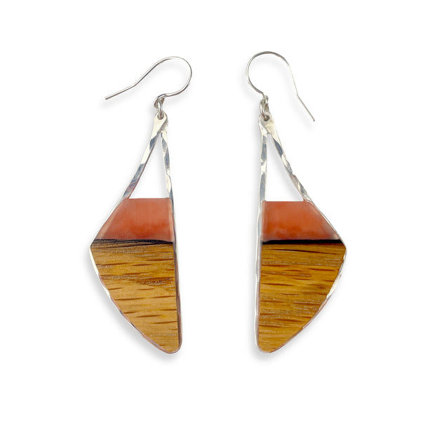Hand-cut bourbon barrel staves capped with hand-tinted resin framed in your choice of hand-forged sterling silver or 14k gold-fill. These bourbon babies measure 2" from the base of the ear wire to the bottom of the earring and are just under 1" wide. 