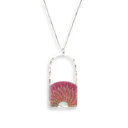 Teasel cross-section suspended in hand-tinted resin, framed in your choice of hand-forged sterling silver or 14k gold-fill. This arched pendant is 1.75" long and just under 1" wide with a total length of 16" and a 1.5" extender.