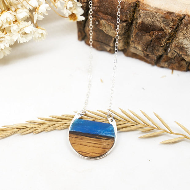 Branch and Barrel "Northbound" Necklace.  Reclaimed Oak Bourbon Barrel Stave and hand tinted resin framed in your choice of hand-forged Sterling Silver or 14k Gold-Fill  New for 2020!  Buy One, Plant One - One tree planted for every Branch+Barrel piece sold!
