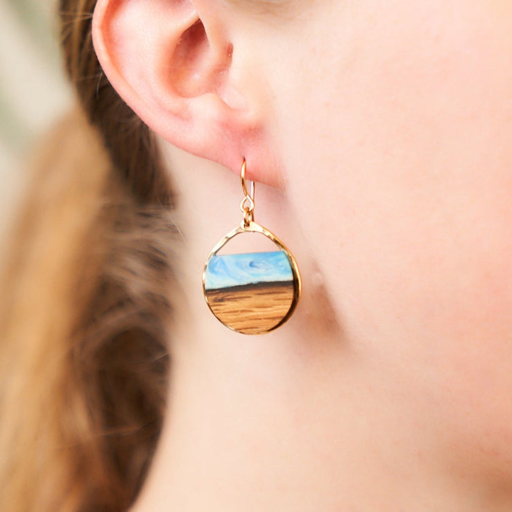 Branch and Barrel "Northbound" Reclaimed Bourbon Barrel Stave Earrings  Reclaimed oak bourbon barrel topped with a hand tinted blue resin and framed in your choice of hand-forged Sterling Silver or 14k Gold-Fill  New for 2020!  Buy One, Plant One - One tree planted for every Branch+Barrel piece sold!