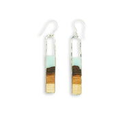 Branch and Barrel “Strata” Turquoise Basswood Rectangle Earrings  Hand cut Basswood framed in hand forged sterling-silver or 14k gold-fill and topped with a hand-tinted turquoise resin.  Buy One, Plant One - One tree planted for every Branch+Barrel piece sold.