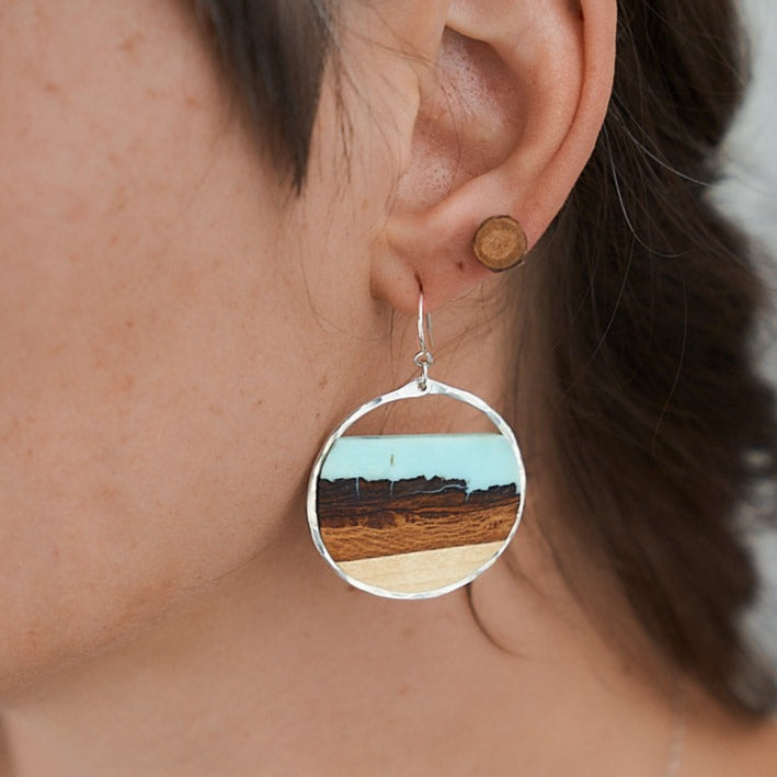 Branch and Barrel “Mesa” - Turquoise Basswood Hoop Earrings - hand cut Basswood framed in hand forged sterling-silver or 14k gold-fill and topped with a hand-tinted turquoise colored resin.  Buy One, Plant One - One tree planted for every Branch+Barrel piece sold.