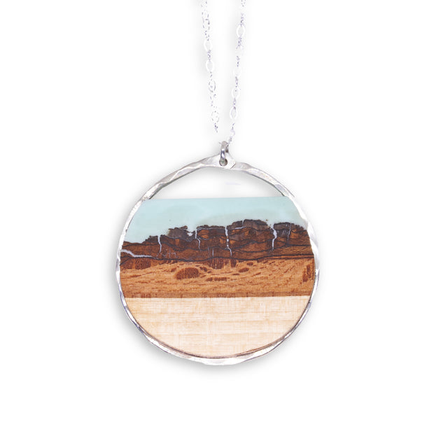 Branch and Barrel "Mesa" Basswood Circle Pendant Necklace  Hand cut basswood with hand tinted resin, framed in your choice of hand forged sterling-silver or 14k gold-fill.  Buy One Plant One - One tree planted for every branch+Barrel piece sold!