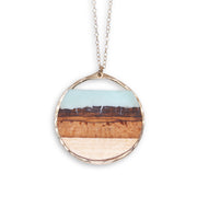 Branch and Barrel "Mesa" Basswood Circle Pendant Necklace  Hand cut basswood with hand tinted resin, framed in your choice of hand forged sterling-silver or 14k gold-fill.  Buy One Plant One - One tree planted for every branch+Barrel piece sold!