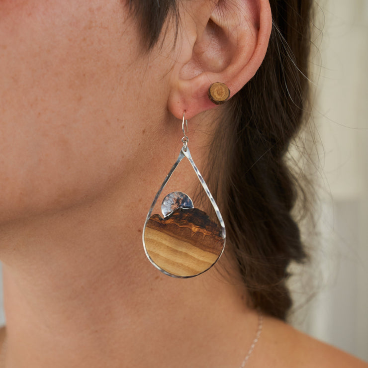 Branch and Barrel Basswood Sunrise Teardrop Earrings  Hand cut Basswood framed in hand forged sterling-silver or 14k gold-fill. sunrise disc hand cut and textured from the same metal as the frame.  Buy One, Plant One - One tree planted for every Branch+Barrel piece sold.