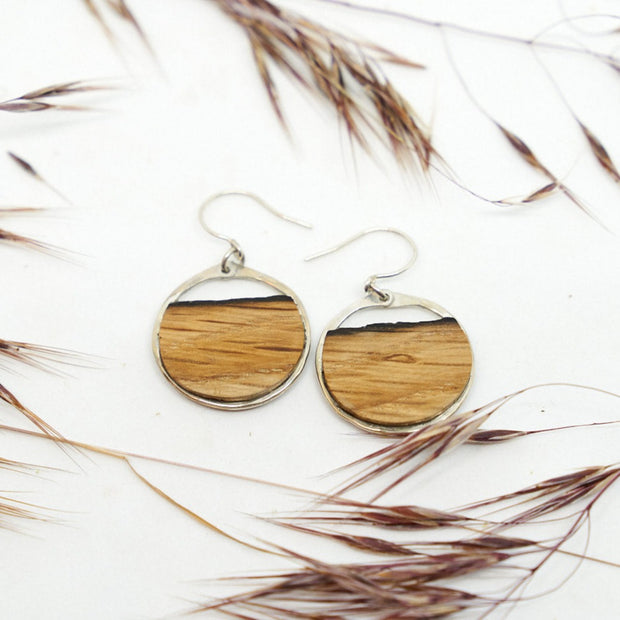 Branch+Barrel Small Barrel Stave Hoop Earrings. Reclaimed oak barrel stave framed in hand forged sterling-silver or 14k gold-fill. Your choice of either red wine or bourbon barrel stave.  Buy One, Plant One - One tree planted for every Branch+Barrel piece sold.