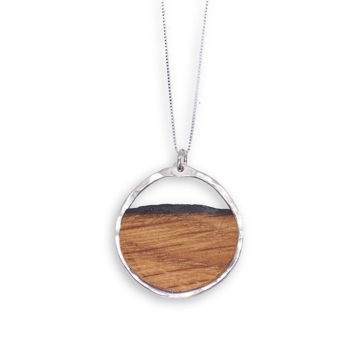 Branch and Barrel Reclaimed Oak Barrel Stave Circle Pendant Necklace  Your choice of hand-cut oak bourbon or wine barrel stave. Pendant is framed in your choice of hand forged sterling silver or 14k gold-fill.   Buy One Plant One Tree - One tree planted for every Branch+Barrel piece sold!